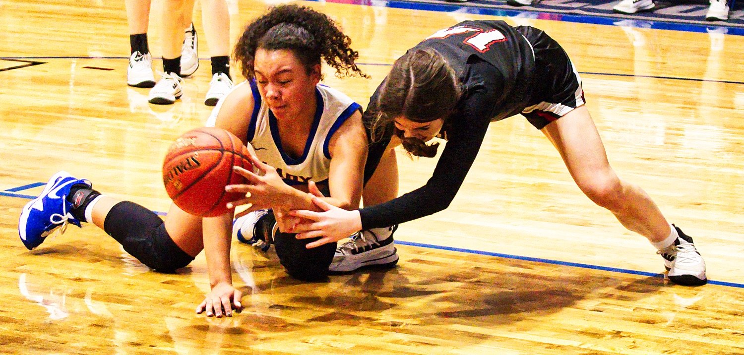 Ashley Davis fights for the loose ball for Quitman in last week’s district loss to Chapel Hill. [shots available to print]
